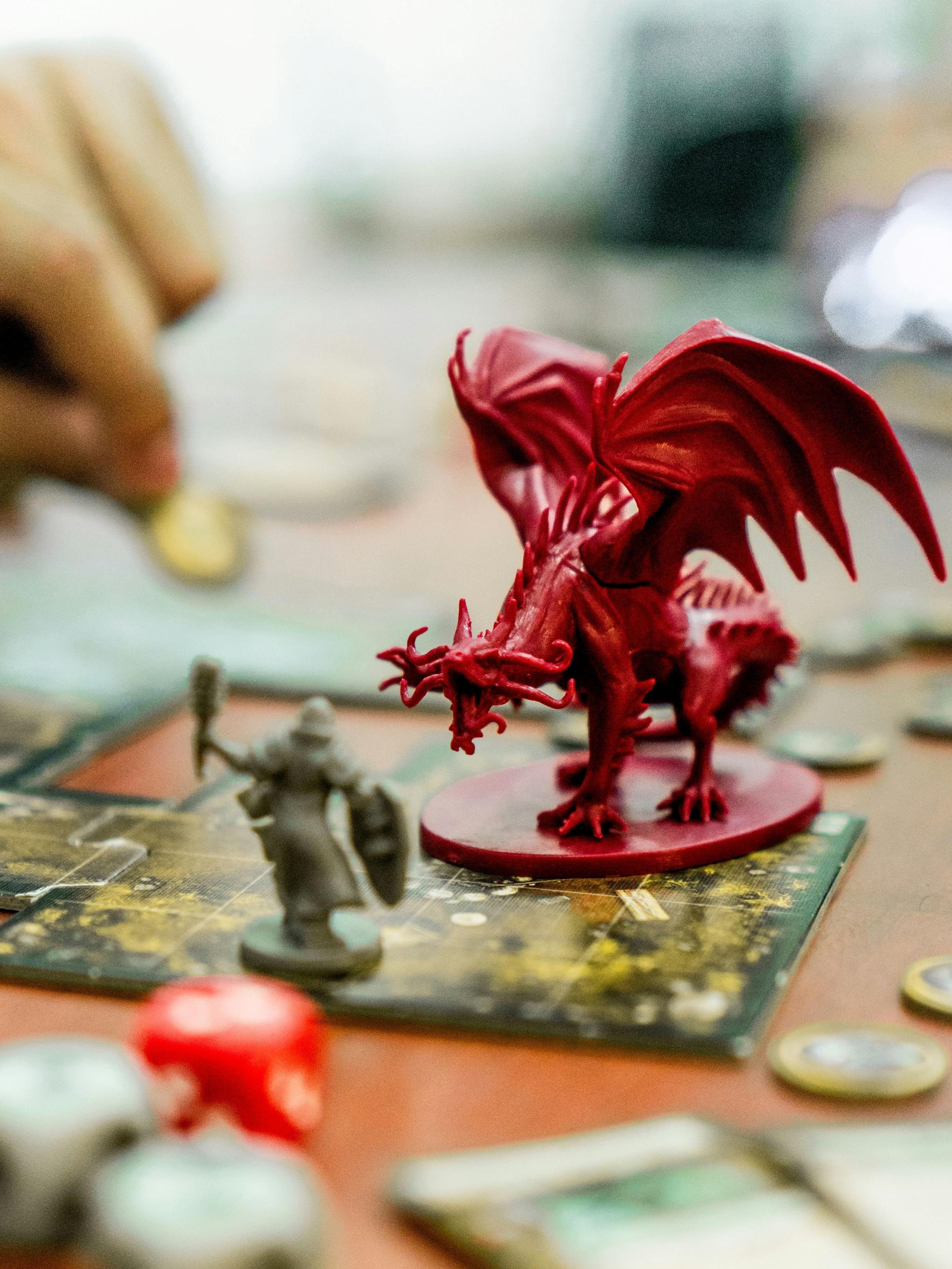 Miniature warrior figurine fighting a dragon